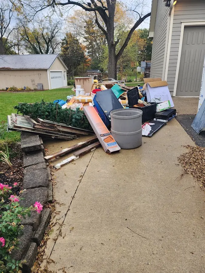 Dumpster being loaded with debris for Commercial Dumpster Rental in Austin